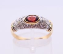 An 18 ct gold ruby and diamond ring. Ring size P.