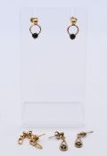 Three pairs of 9 ct gold earrings, the largest 2 cm high. 4.8 grammes total weight.