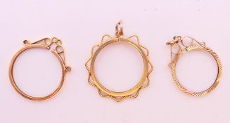 Two 9 ct gold, sovereign mounts and a 9 ct gold half sovereign mount. 5.3 grammes.