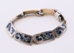A silver bracelet. 16.5 cm long.