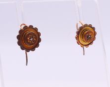 A pair of diamond set gold earrings each, each 8 mm diameter. 1.6 grammes total weight.