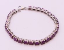 A ruby line bracelet, 18 cm long.