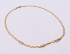 A 9 ct gold necklace, 36 cm long. 5 grammes.