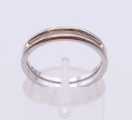 An 18 K white gold Hermes ring, ring size N, 3.2 grammes.