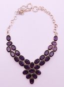 A silver and amethyst pendant necklace, the pendant 5.5 cm high.