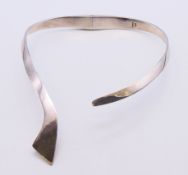 A silver reticulated collar necklace.