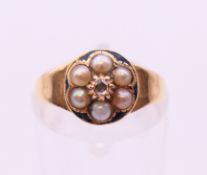 A Victorian 18 ct gold pearl and diamond cluster ring, ring size J.