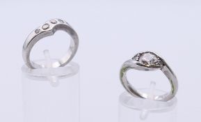 A platinum and diamond engagement ring, the centre stone 0.