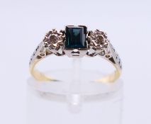 An 18 ct gold diamond and sapphire three-stone ring. Ring size K.
