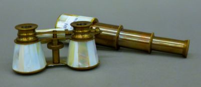 A pair of mother-of-pearl clad opera glasses and a small telescope. The former 10.5 cm wide.