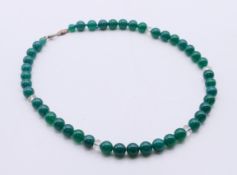A silver and green agate and crystal necklace. 40 cm long.