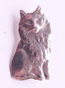 A silver cat brooch. 2 cm high.
