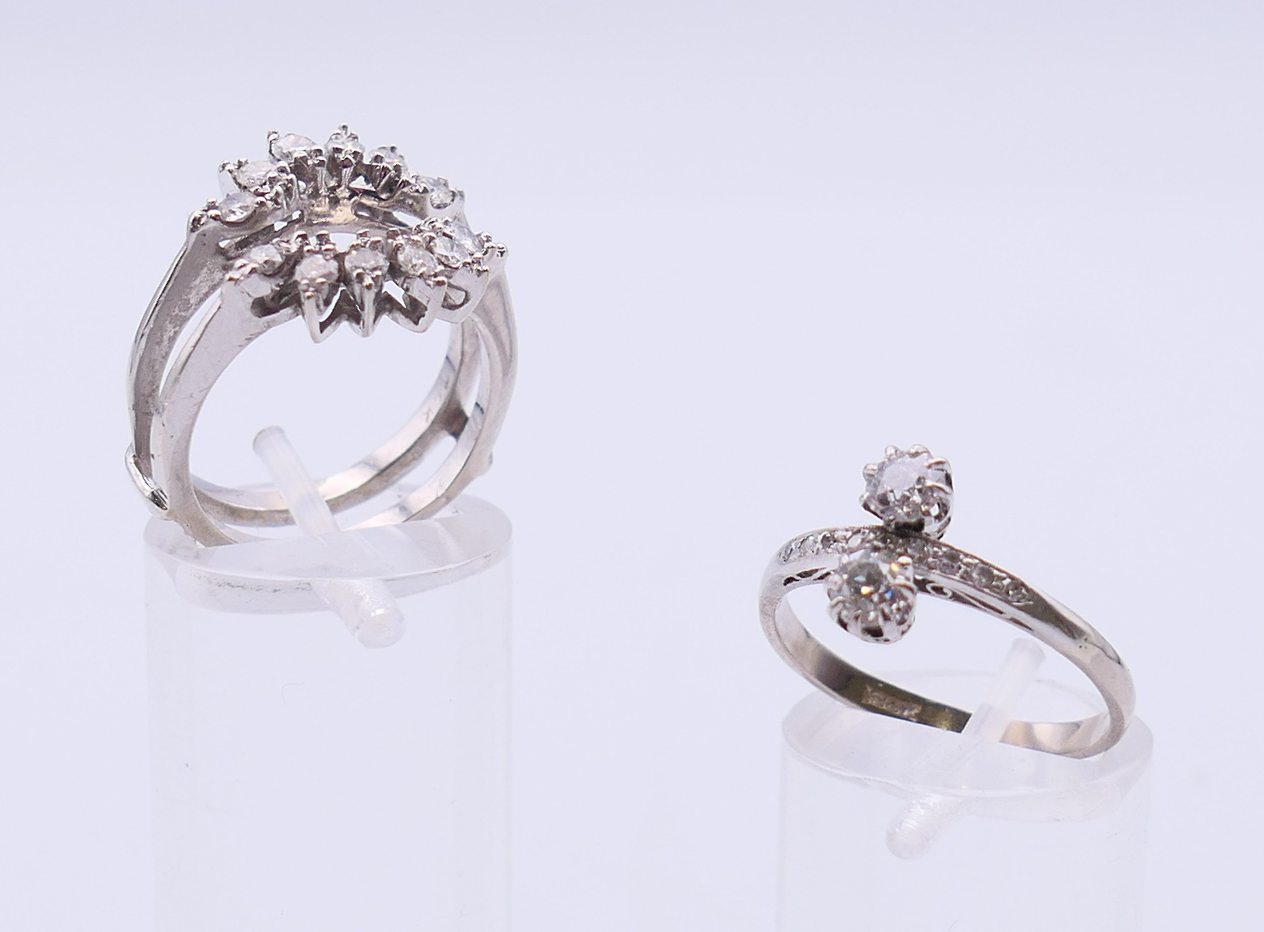 An 18 K white gold and diamond ring (ring size P/Q and 3.