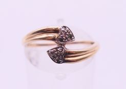 A 9 K gold double heart ring. Ring size N.