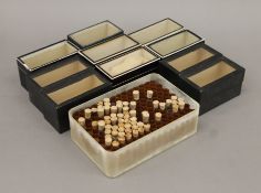 A quantity of specimen boxes and test tubes for bug and butterfly collections.