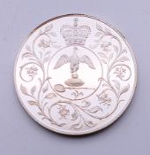 A boxed Elizabeth II Silver Jubilee crown.