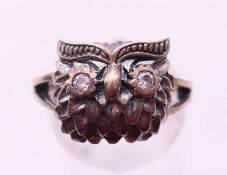A silver owl ring. Ring size N.
