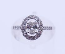 An 18 ct white gold and diamond ring. The central stone spreading to approximately 0.5 carat.