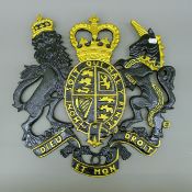 A cast iron coat of arms wall decor. 50 cm wide.