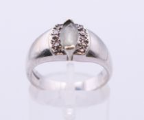 A 9 ct white gold, aquamarine and diamond ring. Ring size M/N.