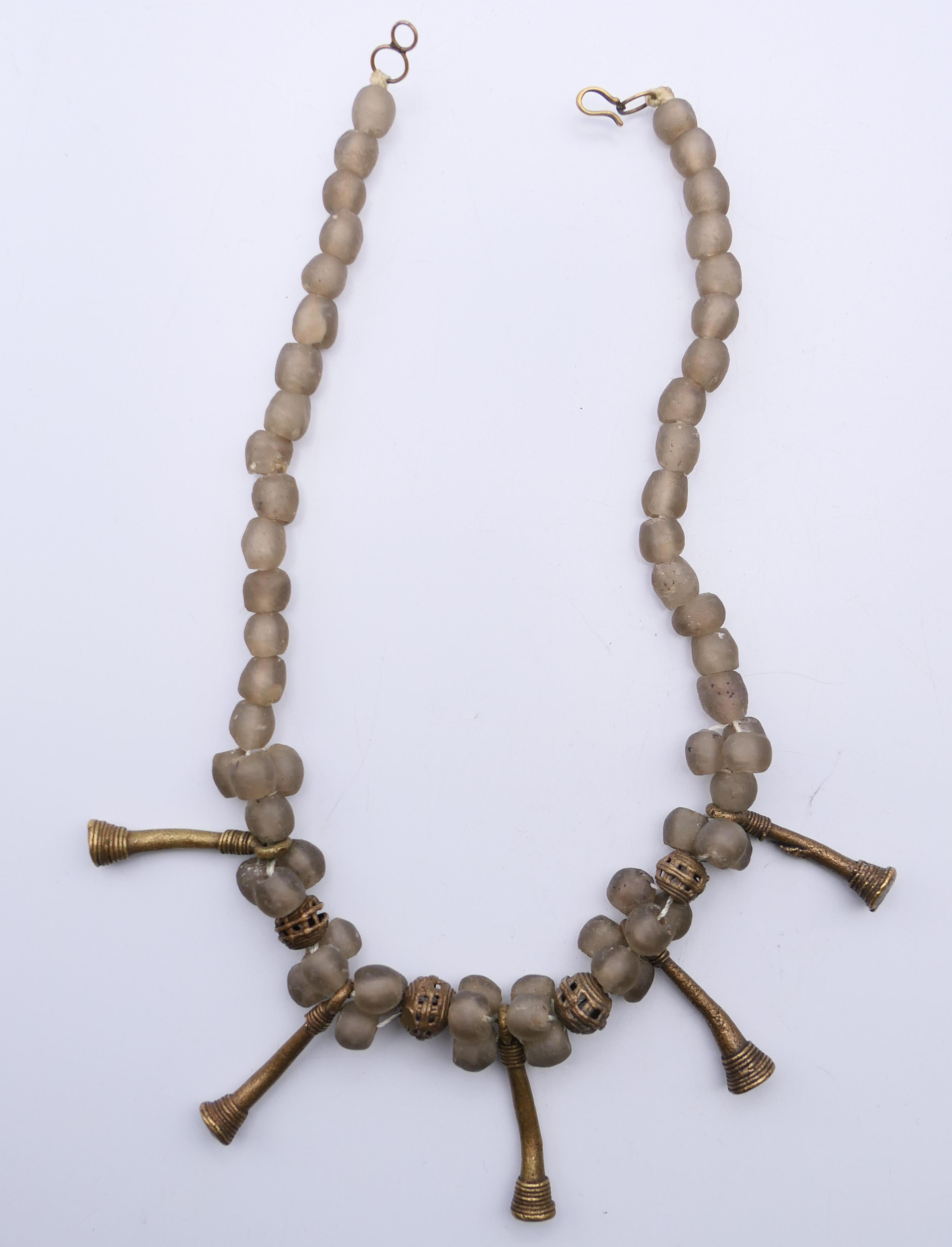 An Ethnic rock crystal necklace, a mixed metal necklace and a pendant. The former 45 cm long. - Image 2 of 7
