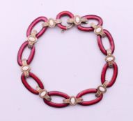 A Russian silver and white and cherry red guilloche enamel bracelet,