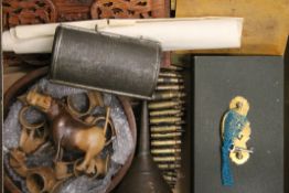 A quantity of miscellaneous items including African carvings, cash box etc. The latter 25 cm wide.