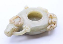 A Chinese jade brush washer. 8.5 cm long.