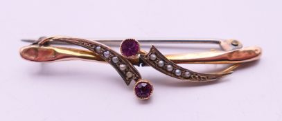 A 9 ct gold bar brooch. 4 .5 cm wide. 1.8 grammes total weight.