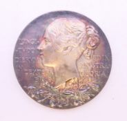 An 1897 Victoria Diamond Jubilee silver medallion in original leather case. The case 8.5 cm square.