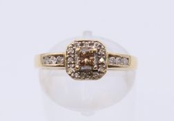 A 9 K gold diamond set ring. Ring size L.