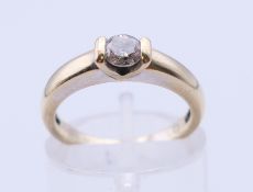 An 18 ct gold and diamond solitaire ring. Ring size J.