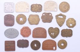 A quantity of various vintage market tokens.