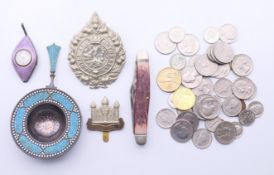 A silver and enamel tea strainer, a silver and enamel watch, coins, cap badges, etc.