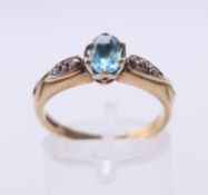 A 9 ct gold and topaz ring. Ring size O.