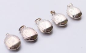 Five silver fob lockets. Each 1.5 cm high.