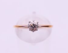 An 18 ct gold diamond solitaire ring. Ring size N.
