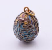 A silver enamel egg pendant bearing Russian marks. 2.2 cm high.