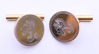 A pair of Langford silver gilt cufflinks. Each 1.5 cm diameter.