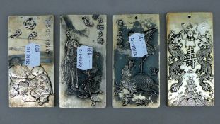 Four Chinese white metal ingots. 10 cm high.