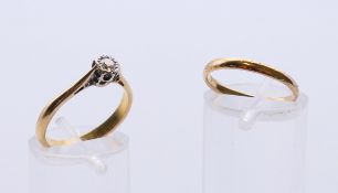 A 22 ct gold and diamond solitaire ring, and a 22 ct gold wedding band.