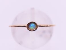 A 9 ct gold and opal ring. Ring size M/N.