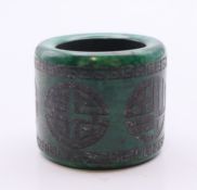A green jade archer's ring. 3 cm high.