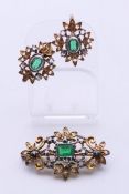 A vintage gilt metal brooch and a matching pair of earrings,