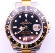 A Rolex GMT-MASTER 11 gentleman's wristwatch. 4 cm wide. Boxed and with paper work.