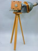 An vintage American bellows camera by the Elwood Pattern Works, Indianapolis on a tripod.