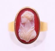 An unmarked gold cameo ring. Ring size O.