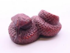A netsuke in the form of a snake. 5.5 cm long.