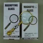 Two magnifying glasses. The largest 16.5 cm long.