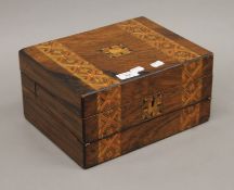A Victorian inlaid walnut writing box. 30.5 cm wide.